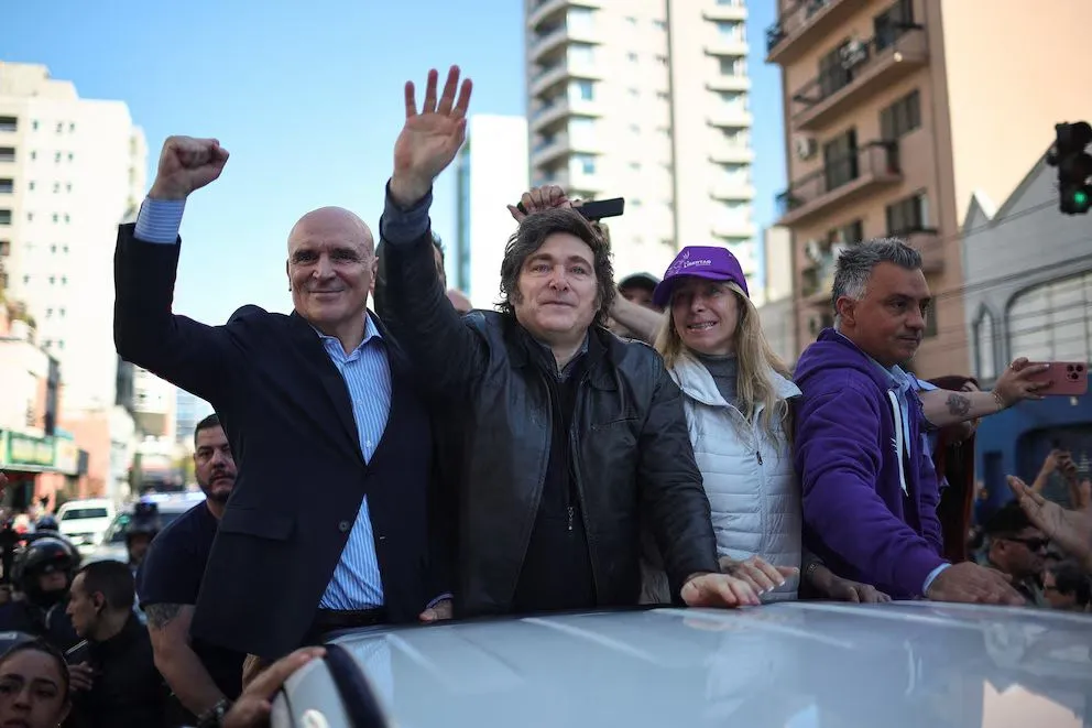 José Luis Espert junto a Javier y Karina Milei.